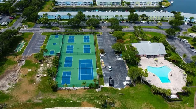 an aerial view of a house with outdoor space and lake view