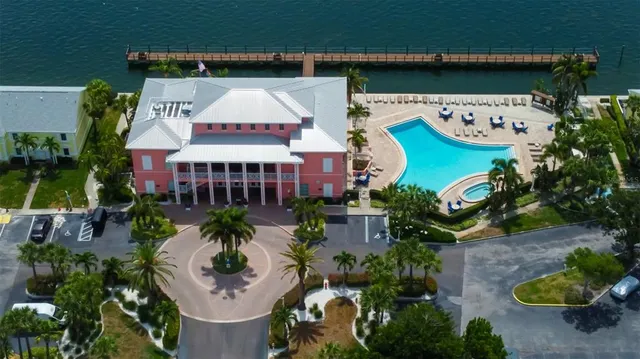 an aerial view of a house with yard swimming pool and outdoor seating