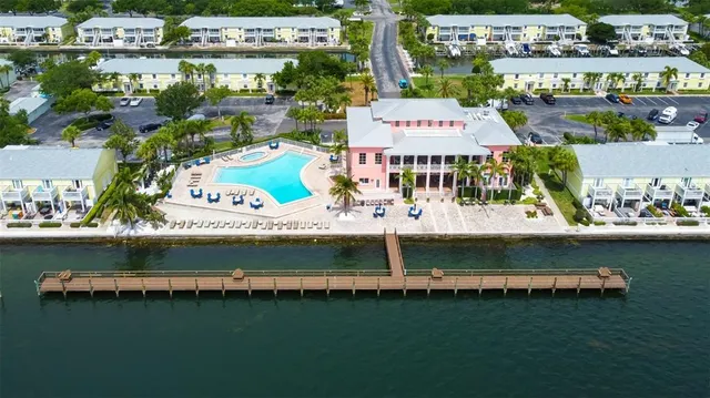 a large body of water with a building in the background
