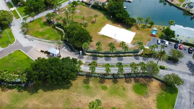 an aerial view of residential houses with outdoor space and swimming pool