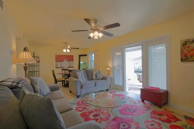 a living room with furniture and a rug