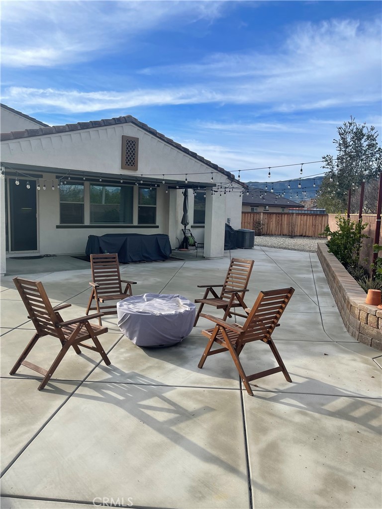 29192 Jacaranda Lake Elsinore, CA 92530 - Photo 3 of 7 a patio with patio table and chairs
