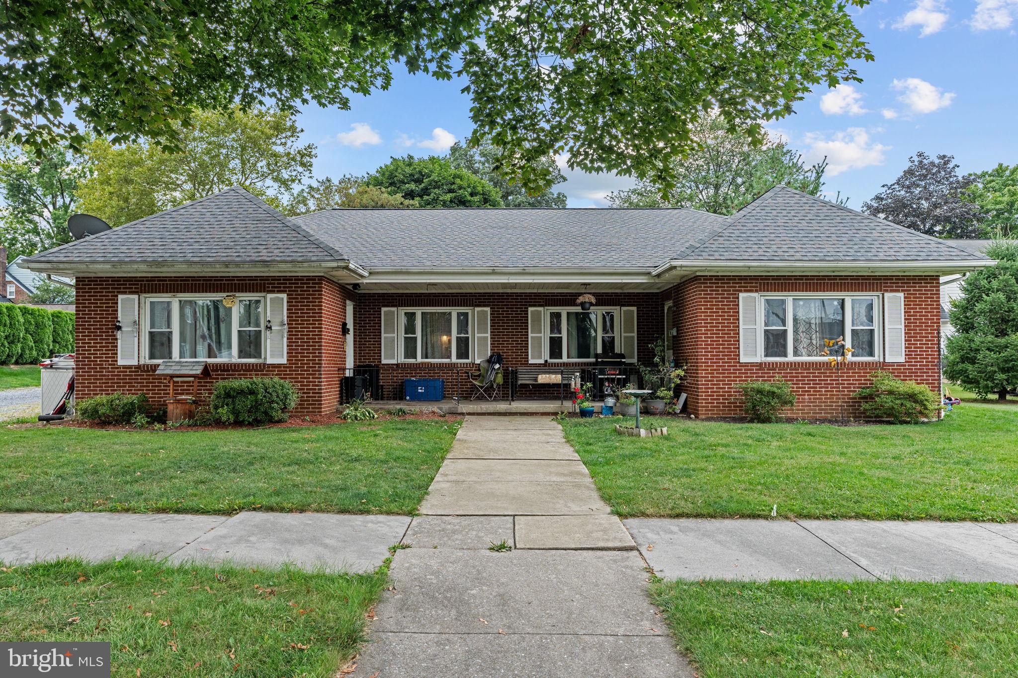 107-109 South Forge Road Palmyra, PA 17078 - Photo 1 of 22 a front view of a house with yard patio and green space