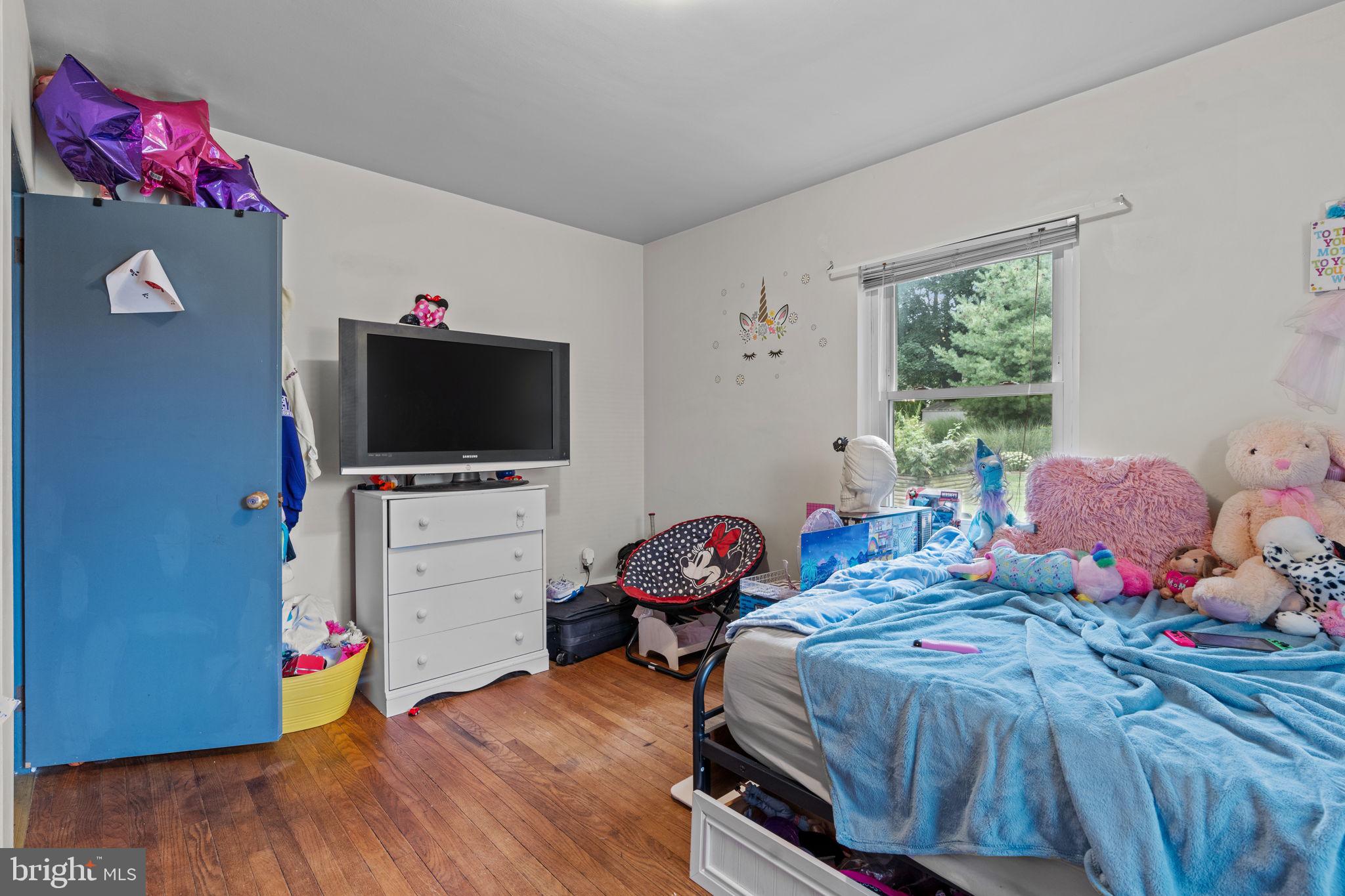 107-109 South Forge Road Palmyra, PA 17078 - Photo 14 of 22 a bedroom with a bed and a flat screen tv