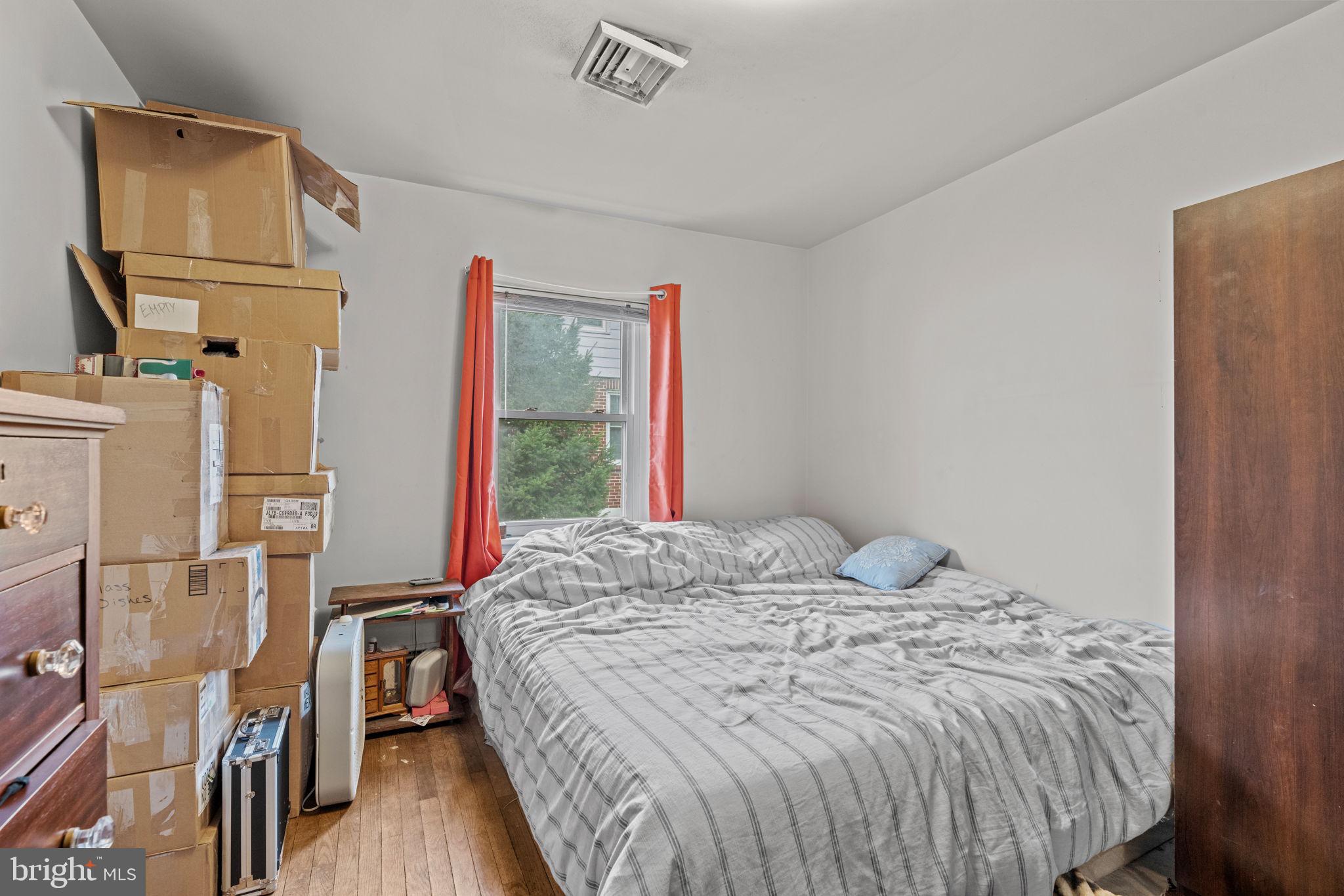 107-109 South Forge Road Palmyra, PA 17078 - Photo 16 of 22 a bed sitting in a bedroom next to a window