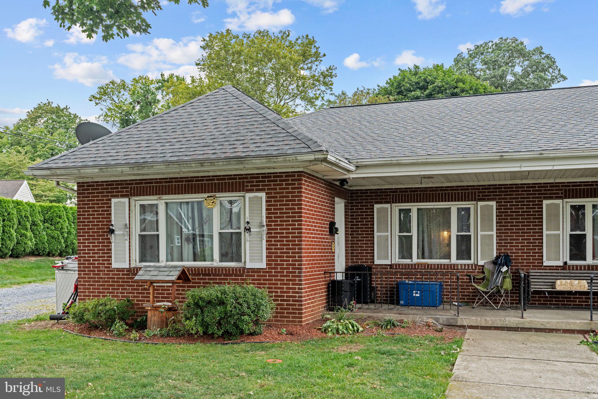 107-109 South Forge Road Palmyra, PA 17078 - Photo 2 of 22 a front view of a house with garden