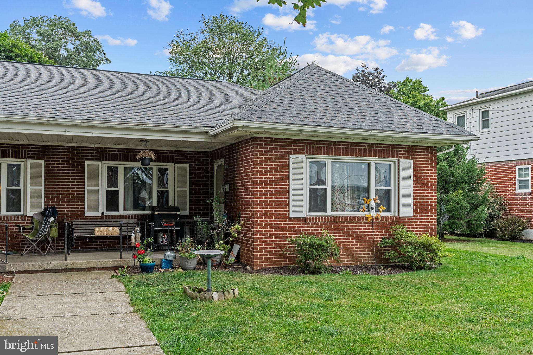 107-109 South Forge Road Palmyra, PA 17078 - Photo 3 of 22 a front view of a house with a yard