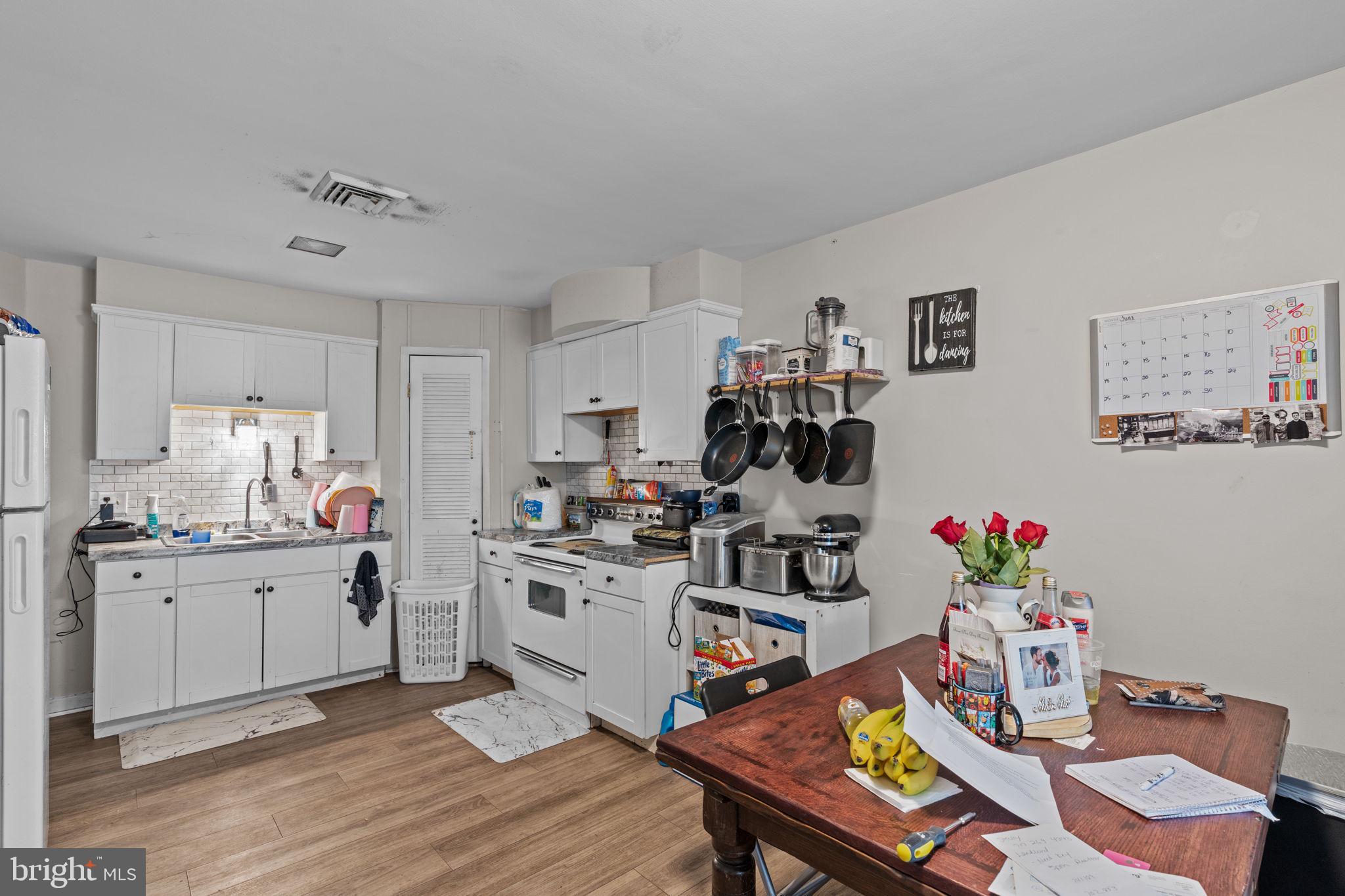 107-109 South Forge Road Palmyra, PA 17078 - Photo 4 of 22 a very nice looking dining room with kitchen island wooden floor and a sink