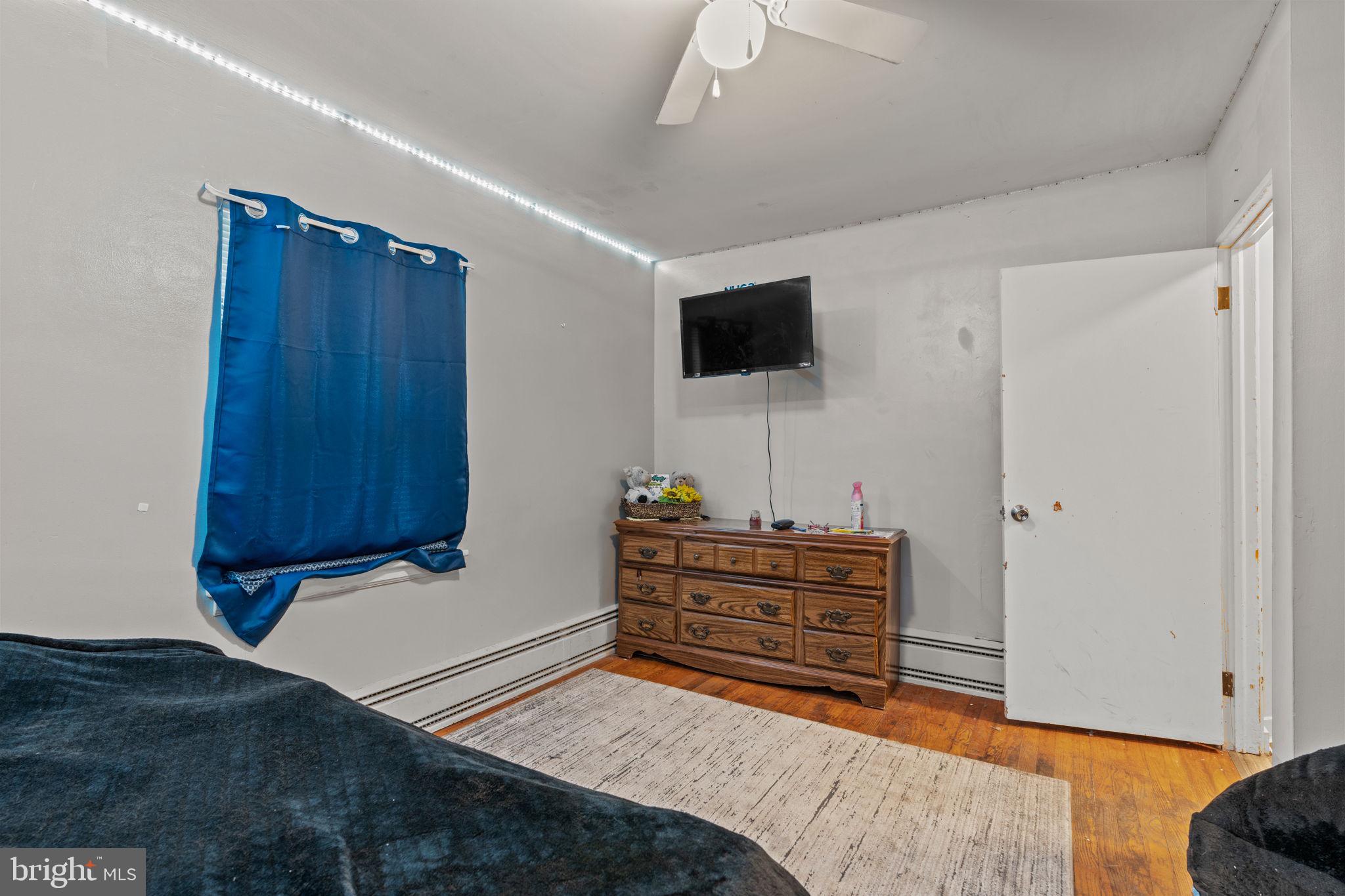 107-109 South Forge Road Palmyra, PA 17078 - Photo 8 of 22 a bedroom with a bed and a flat screen tv