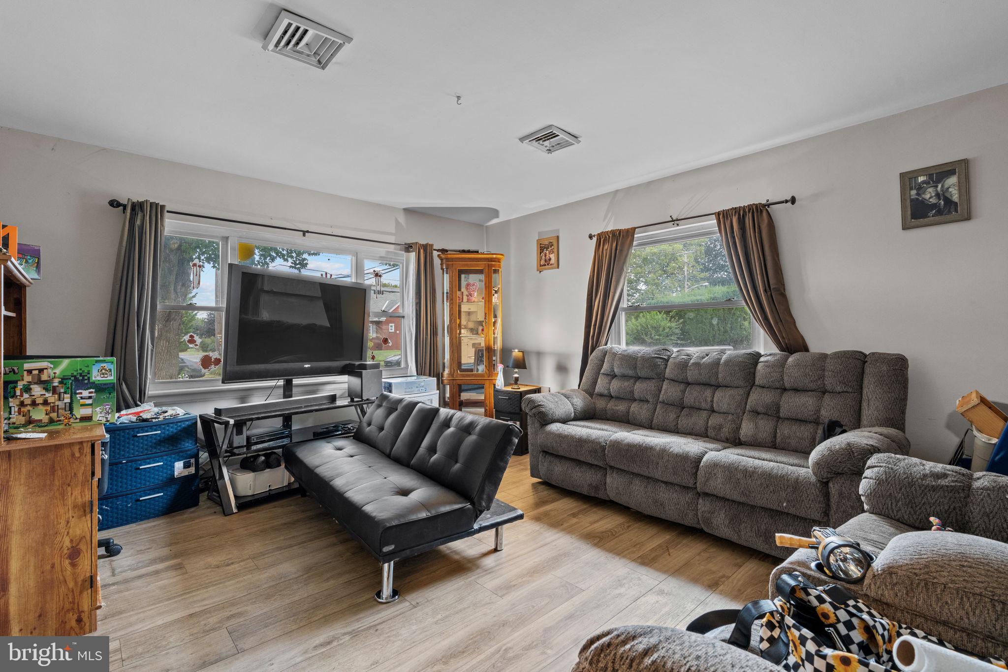 107-109 South Forge Road Palmyra, PA 17078 - Photo 10 of 22 a living room with furniture and a flat screen tv