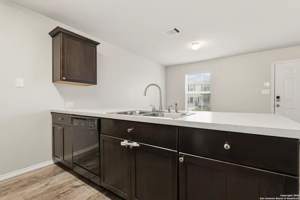 a kitchen with a stove and a microwave