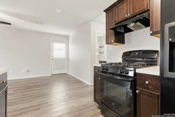 a kitchen with a sink and cabinets