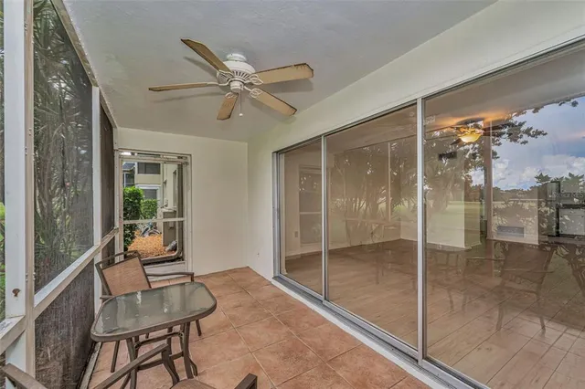 a view of a room with furniture and a window