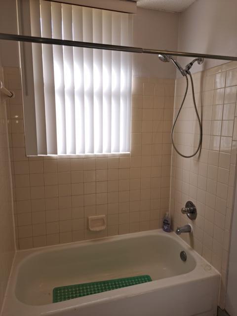 701 Lyons Road, Unit 13208 Coconut Creek, FL 33063 - Photo 12 of 31 a bathroom with a bathtub and a shower