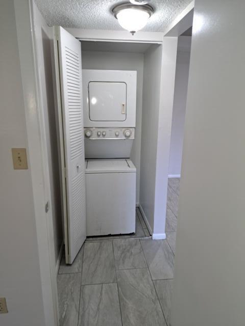 701 Lyons Road, Unit 13208 Coconut Creek, FL 33063 - Photo 18 of 31 a utility room with a sink a washer and dryer