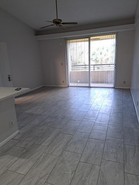 701 Lyons Road, Unit 13208 Coconut Creek, FL 33063 - Photo 19 of 31 a view of an empty room with a window