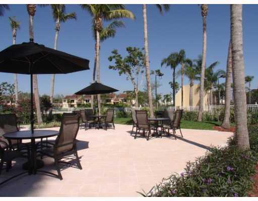701 Lyons Road, Unit 13208 Coconut Creek, FL 33063 - Photo 24 of 31 an outdoor space with patio