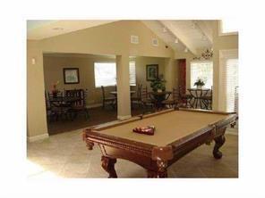 701 Lyons Road, Unit 13208 Coconut Creek, FL 33063 - Photo 27 of 31 a room with pool table and windows