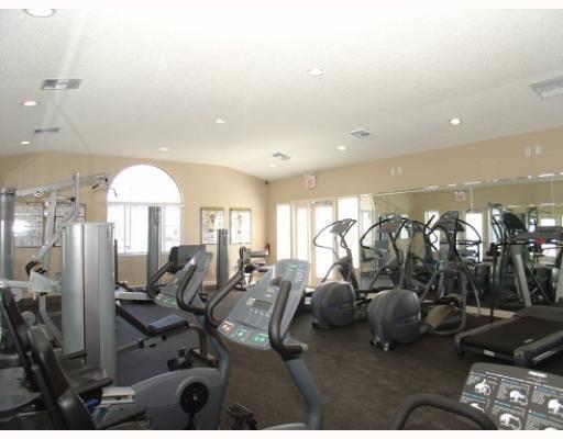 701 Lyons Road, Unit 13208 Coconut Creek, FL 33063 - Photo 29 of 31 a view of a room with gym equipment