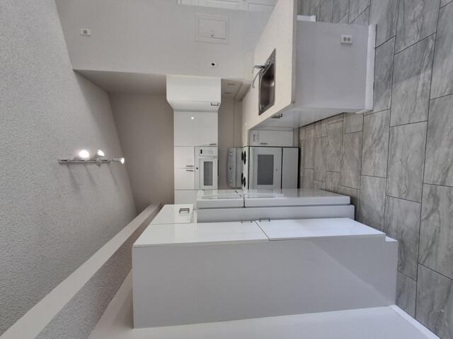 701 Lyons Road, Unit 13208 Coconut Creek, FL 33063 - Photo 7 of 31 a view of entryway and hall with a bath tub