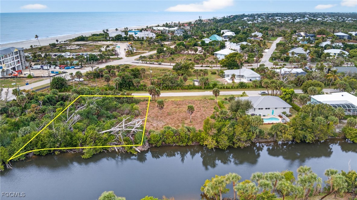3304 St Kilda Road Sanibel, FL 33957 - Photo 19 of 23 an aerial view of residential houses with outdoor space and lake view