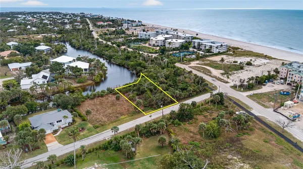 an aerial view of a residential houses with outdoor space