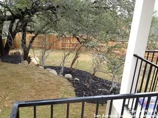 a view of a yard from a balcony