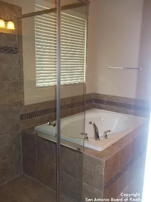 a bath tub sitting next to a window