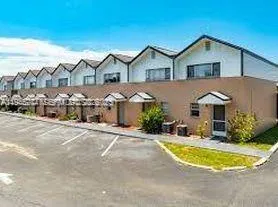 a view of a house with a swimming pool