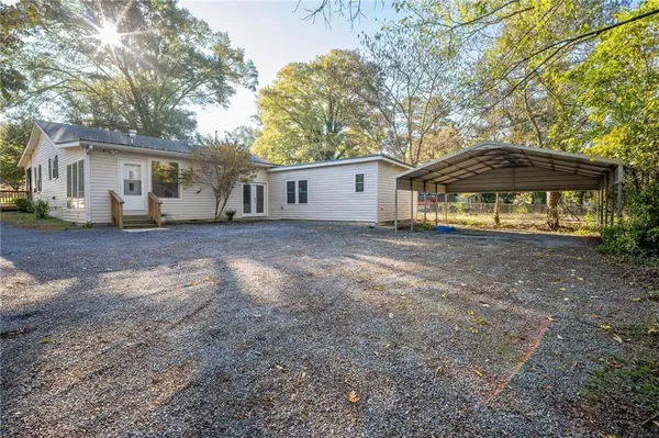 a house that has a tree in front of it