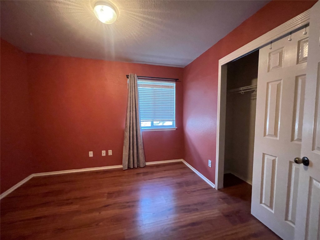 3508 Blue Ridge Drive Round Rock, TX 78681 - Photo 10 of 26 an empty room with wooden floor and windows