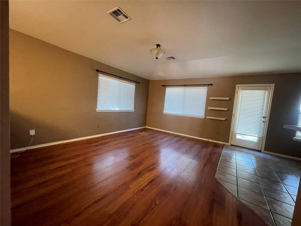 3508 Blue Ridge Drive Round Rock, TX 78681 - Photo 17 of 26 an empty room with wooden floor and windows