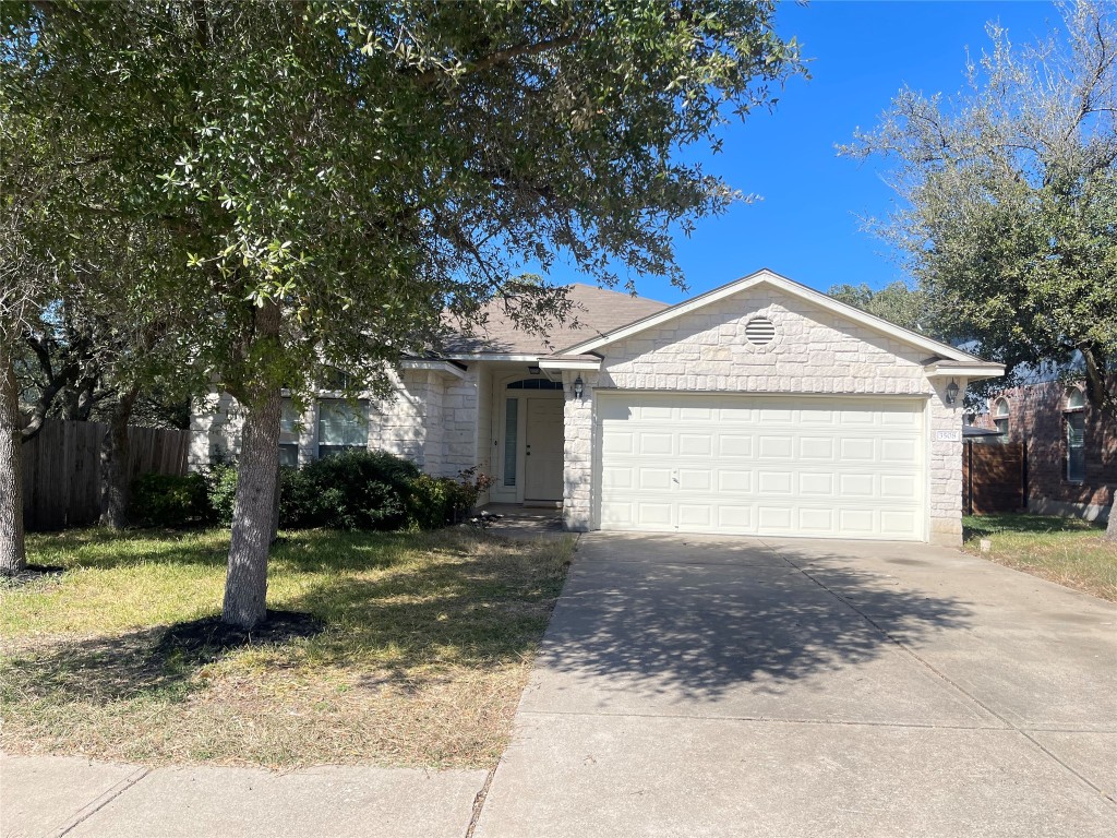 3508 Blue Ridge Drive Round Rock, TX 78681 - Photo 2 of 26 a front view of a house with a yard and garage