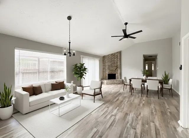 a living room with furniture and a table