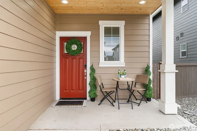 a view of a chair and table in the patio
