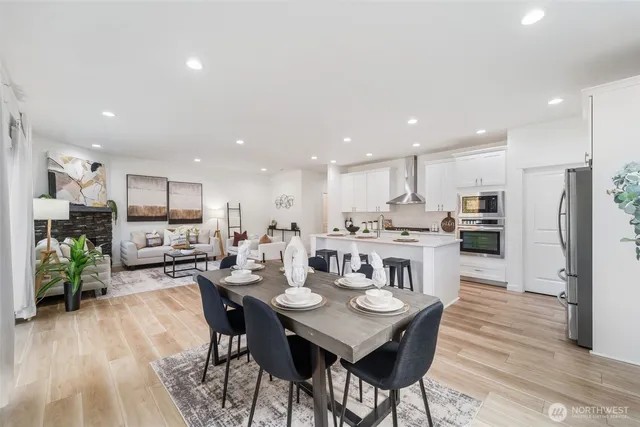 a kitchen with a table and chairs in it