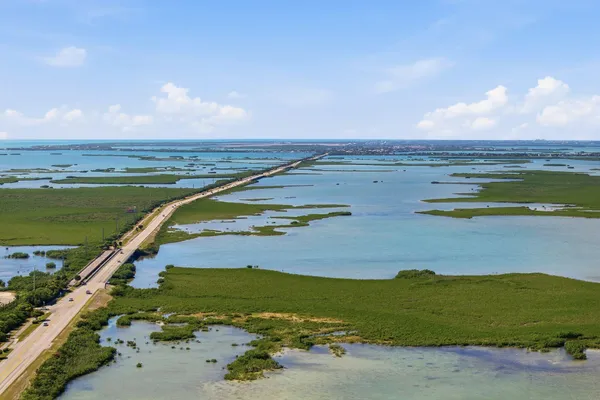 an aerial view of beach and ocean