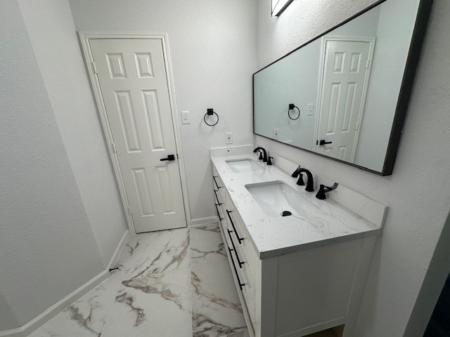 4702 11th Street Brookshire, TX 77423 - Photo 11 of 23 a bathroom with a sink vanity and mirror