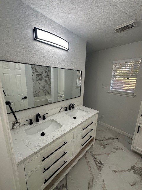 4702 11th Street Brookshire, TX 77423 - Photo 15 of 23 a bathroom with a sink and mirror