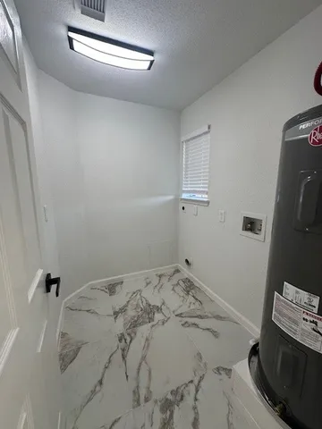 a bedroom with a bed and a stove