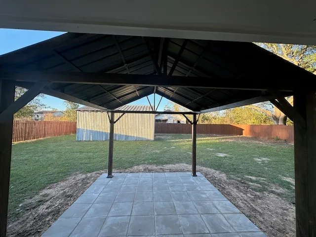 a view of a backyard of the house