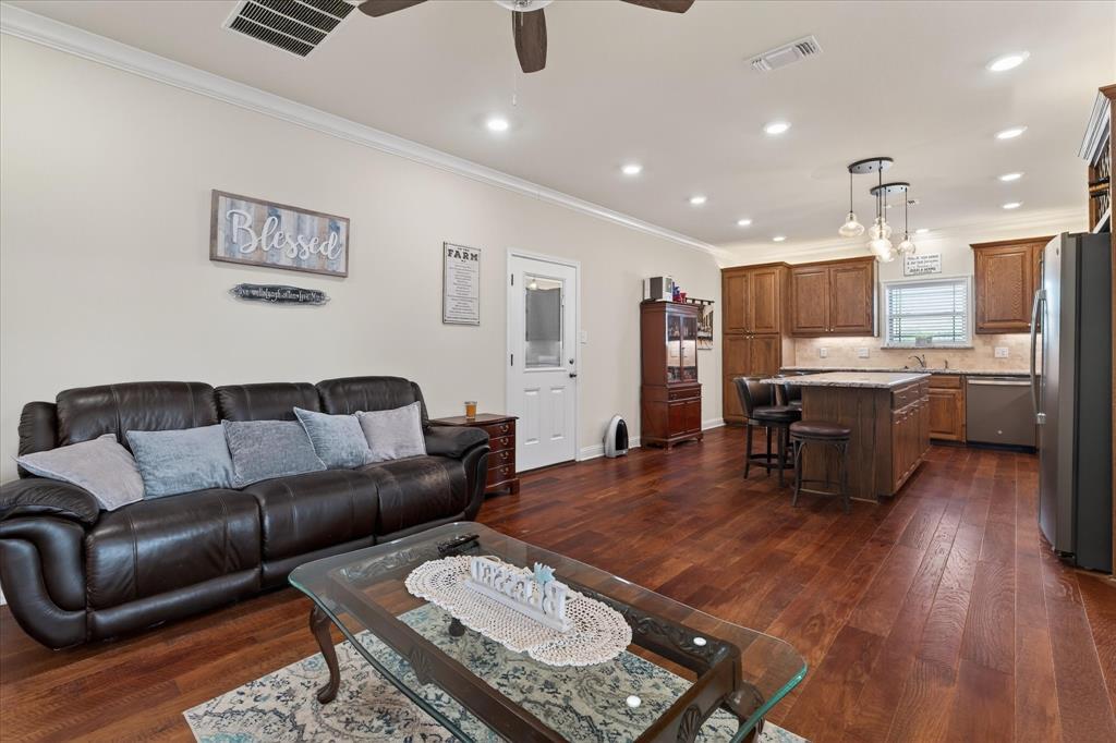 790 Bones Chapel Road Whitesboro, TX 76273 - Photo 32 of 39 a living room with stainless steel appliances furniture and wooden floor