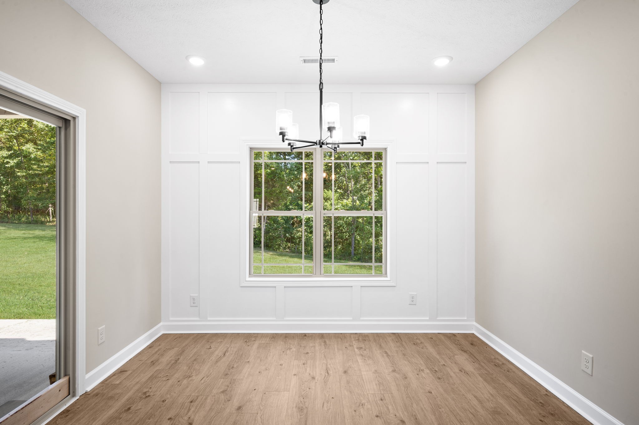 1749 Powell Road Clarksville, TN 37043 - Photo 13 of 50 a view of a room with window wooden floor and a chandelier