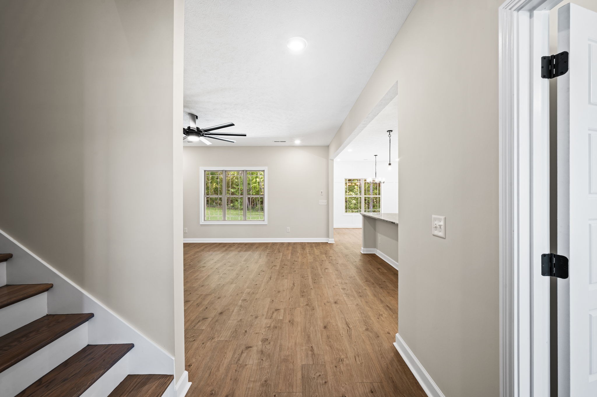 1749 Powell Road Clarksville, TN 37043 - Photo 29 of 50 a view of an empty room with wooden floor and a window
