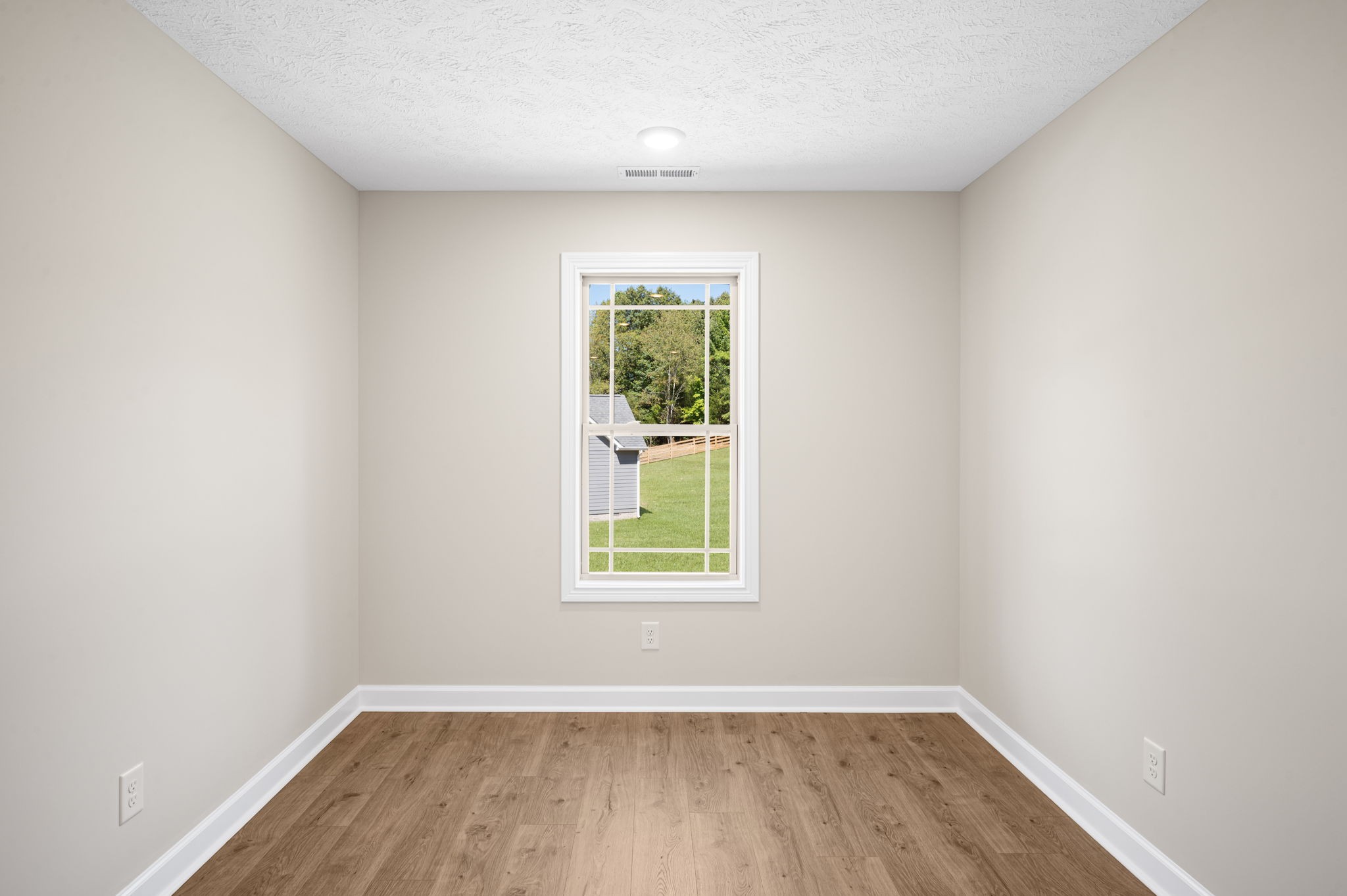 1749 Powell Road Clarksville, TN 37043 - Photo 35 of 50 an empty room with wooden floor and windows