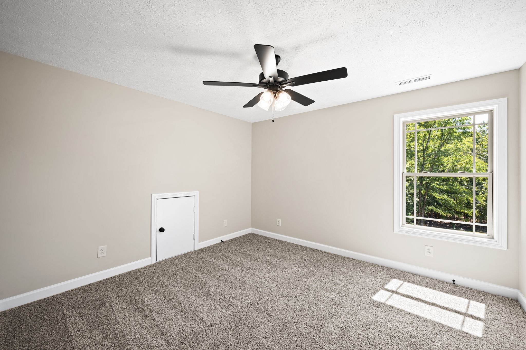 1749 Powell Road Clarksville, TN 37043 - Photo 42 of 50 an empty room with a window and a fan