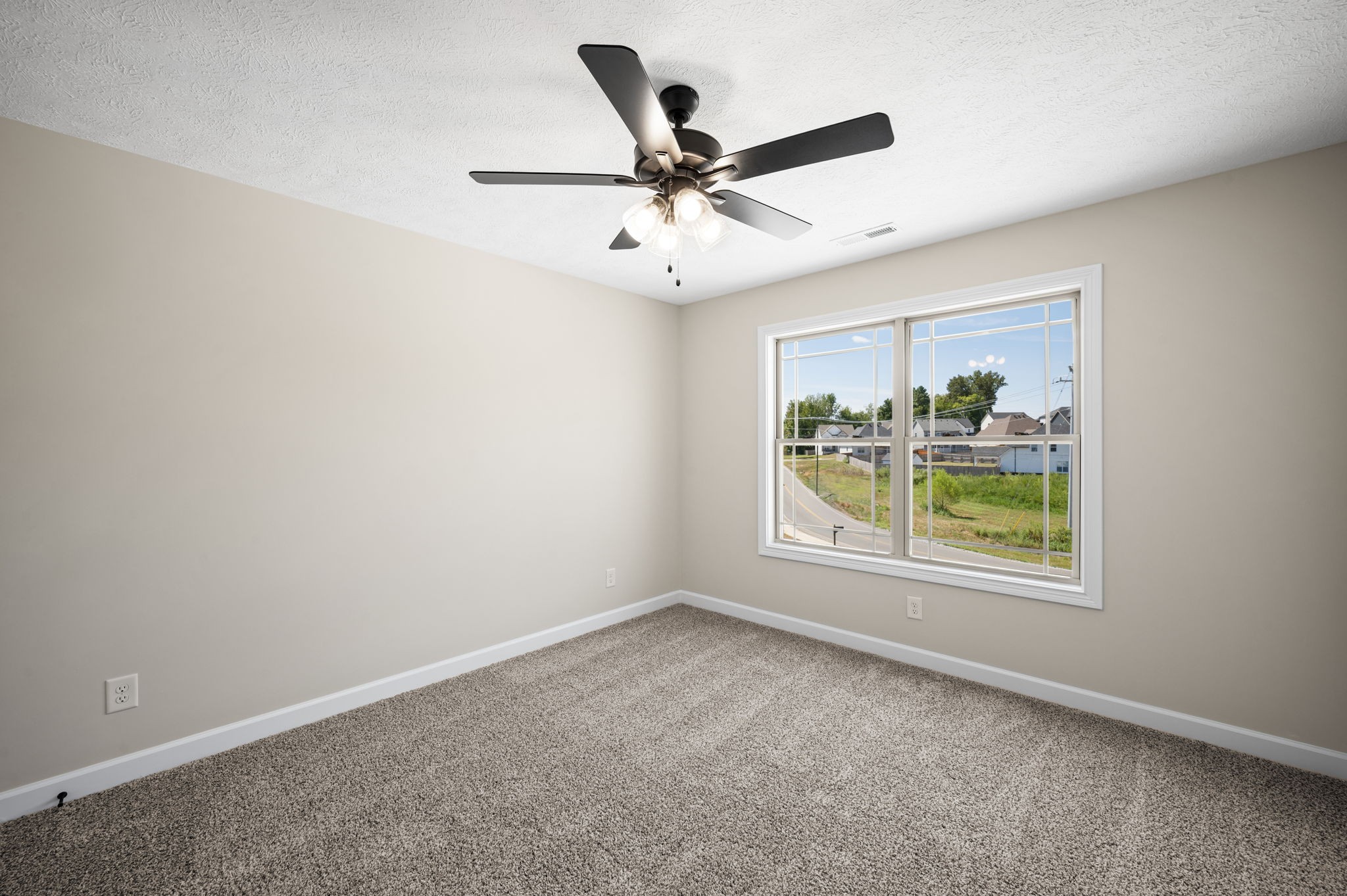 1749 Powell Road Clarksville, TN 37043 - Photo 44 of 50 an empty room with window and ceiling fan