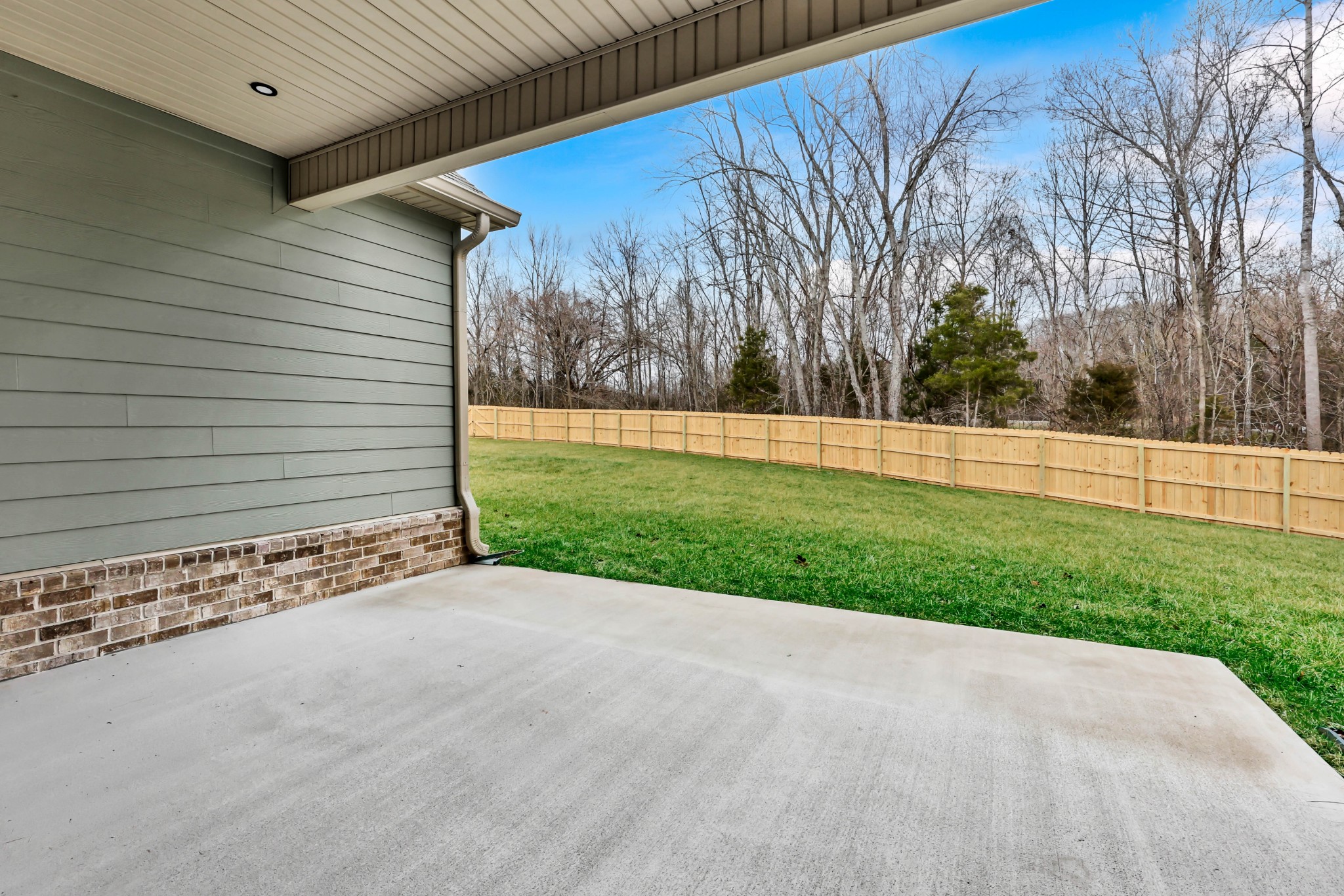 1749 Powell Road Clarksville, TN 37043 - Photo 47 of 50 a view of a backyard with barn plants and large trees