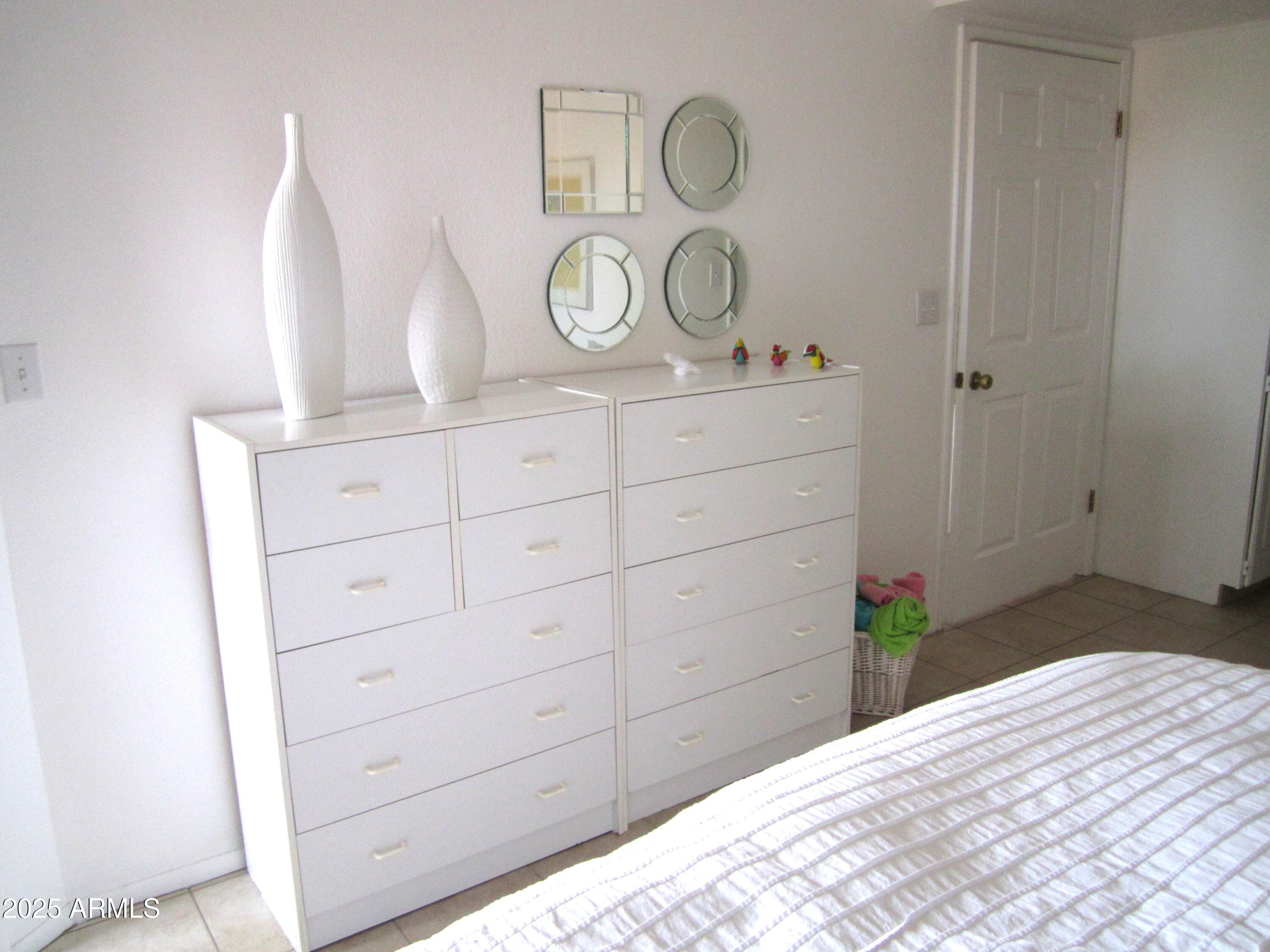 4303 East Cactus Road, Unit 413 Phoenix, AZ 85032 - Photo 14 of 30 a view of a dresser