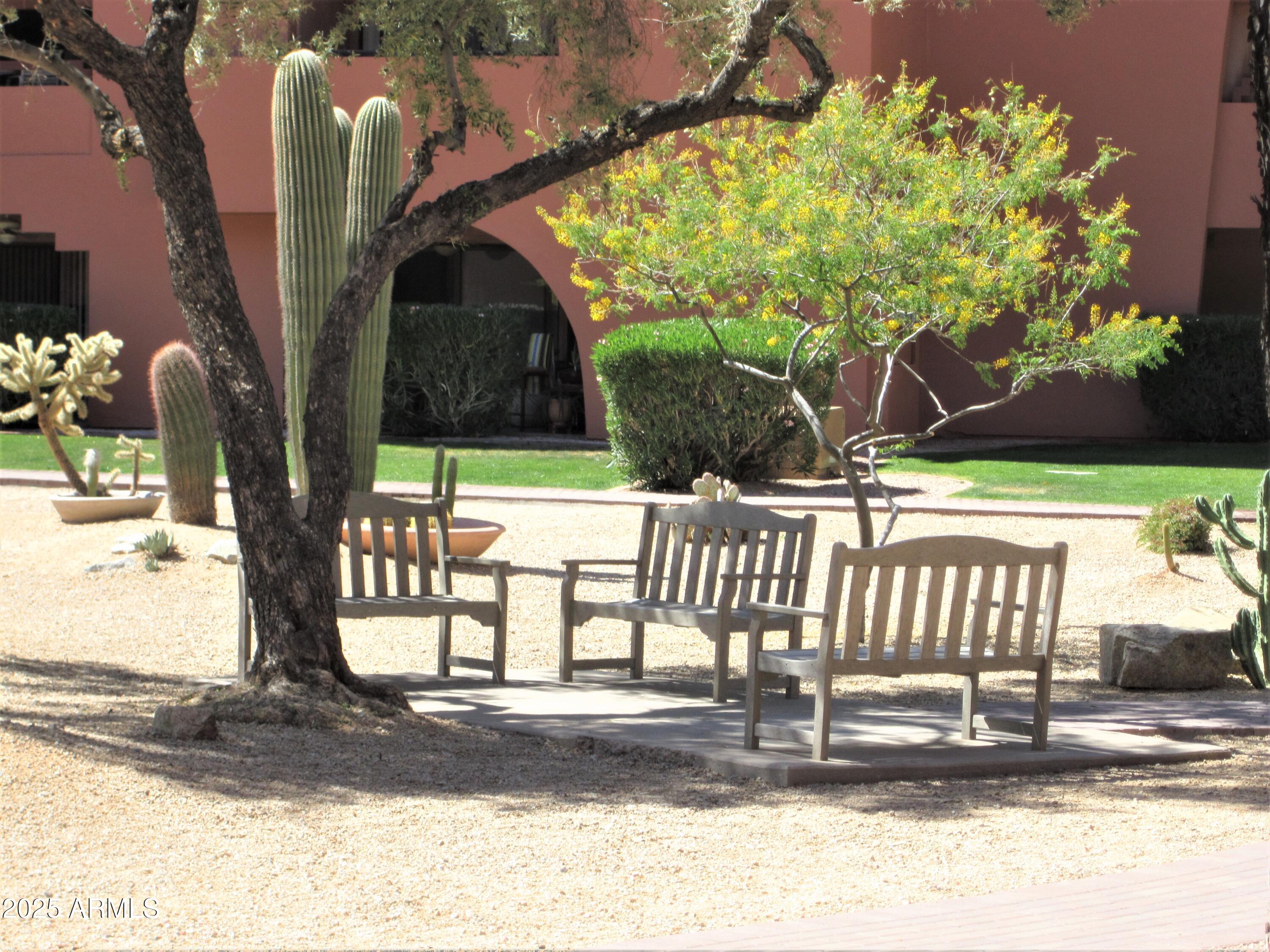 4303 East Cactus Road, Unit 413 Phoenix, AZ 85032 - Photo 22 of 30 a view of a porch with a bench